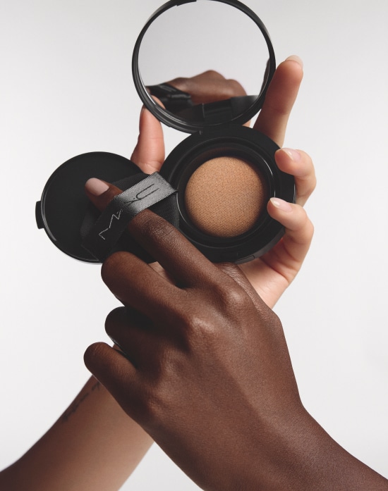 Closeup of model applying our iconic Velvet Teddy Matte Lipstick