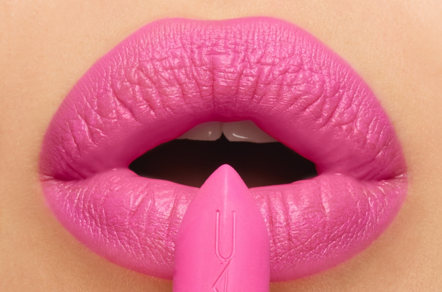 Closeup of model applying our iconic Velvet Teddy Matte Lipstick